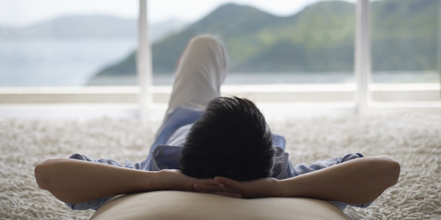 Man Lying Down and Looking Out of Picture Window