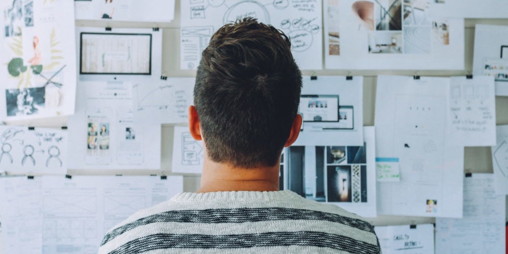 Man looking at board