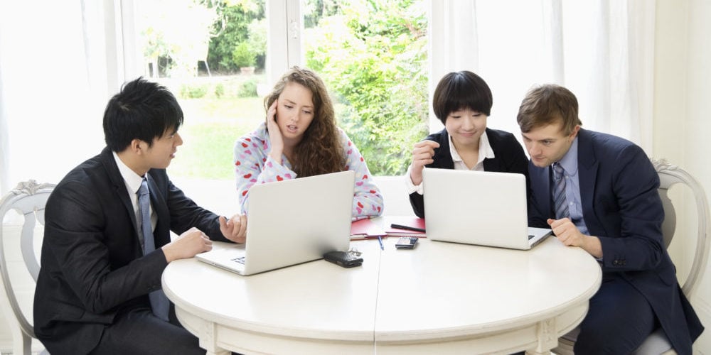 Group of businesspeople working on laptop