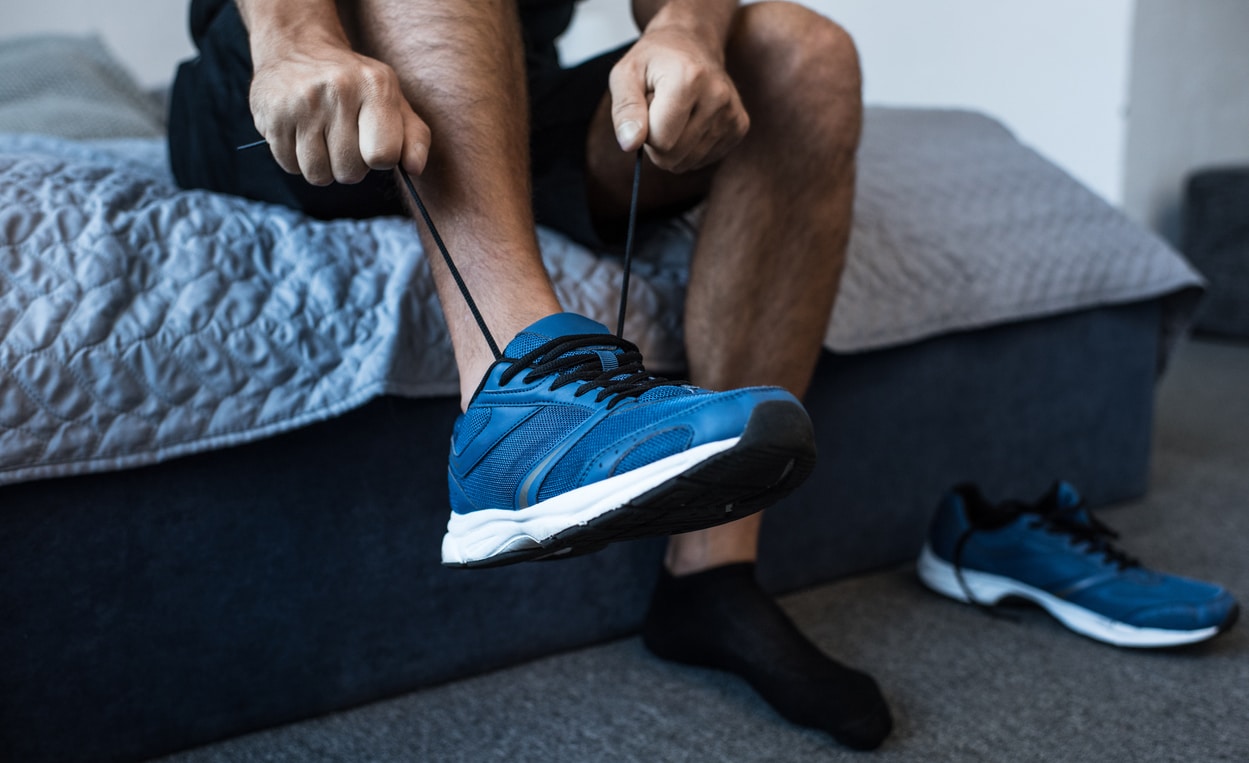 Running shoes beside bed