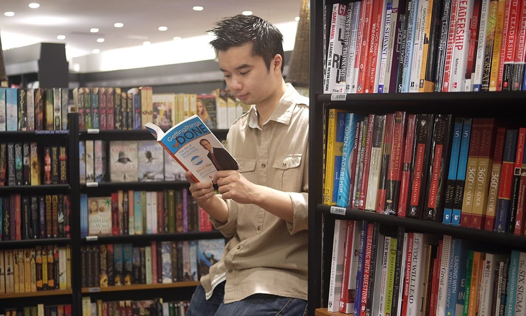 Thanh holding the GTD book